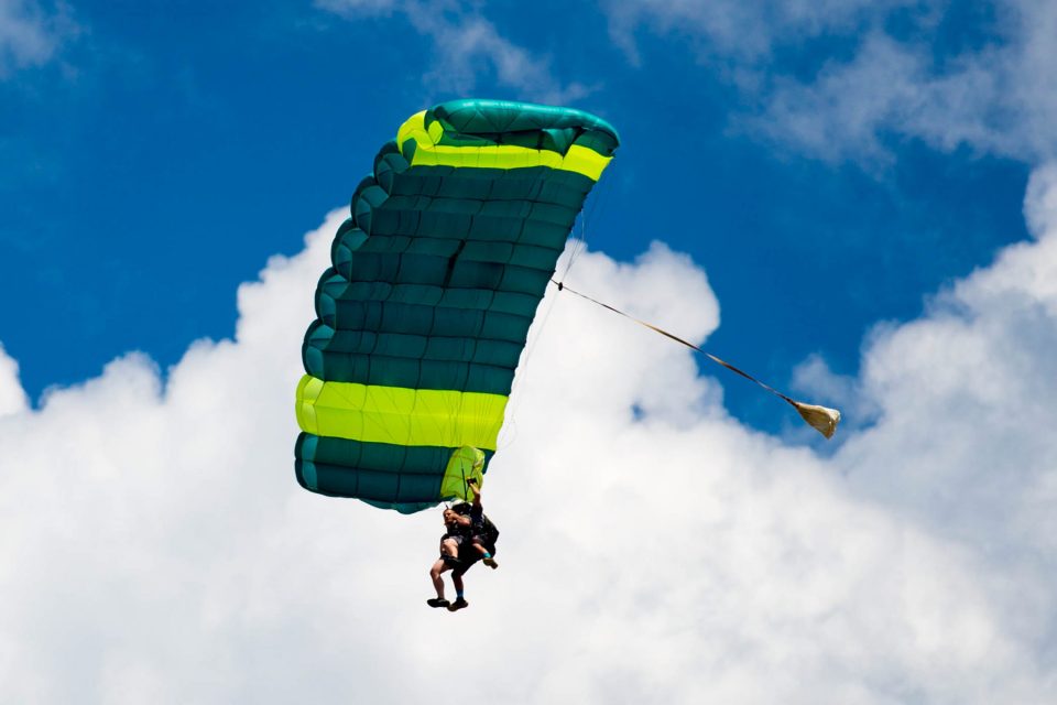 tandem skydiver enjoying the canopy ride portion of his skydive